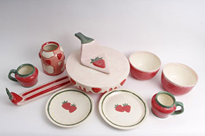 image of several pieces of pottery decorated wih a strawberry design