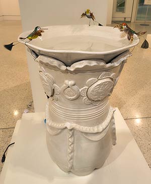 a photo of a large pottery bird bath, an object made by the teacher