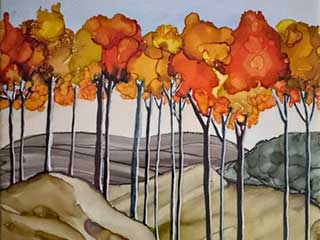 an example of alcohol ink on tile featuring autumn leaves