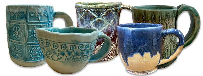 holiday mugs, handmade by arts center memebers