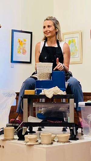 photo of Rachel Consolazio, ceramic artist, creating artwork